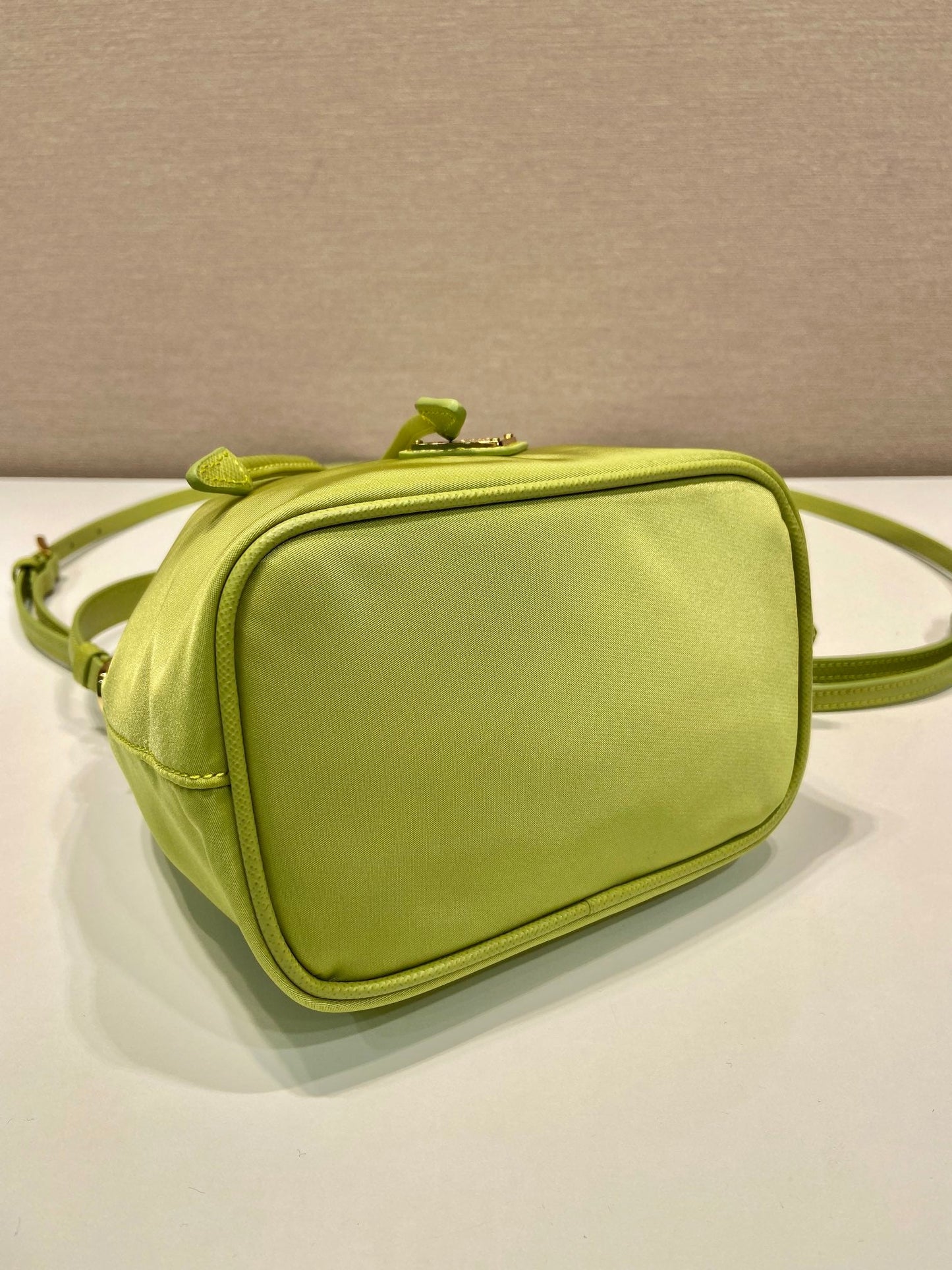 BUCKET BAG 19 IN APPLE GREEN RE-NYLON AND SAFFIANO LEATHER HANDLE
