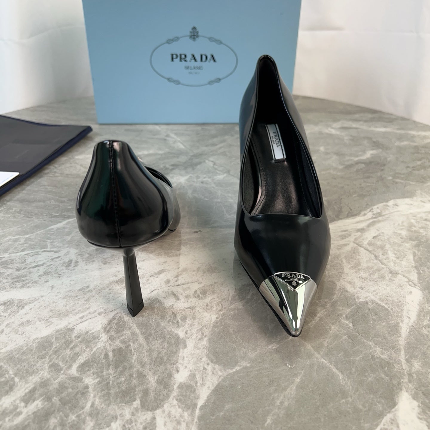 PRADA 25S METAL-CAPPED POINTED-TOE HIGH HEELS IN BLACK CALFSKIN
