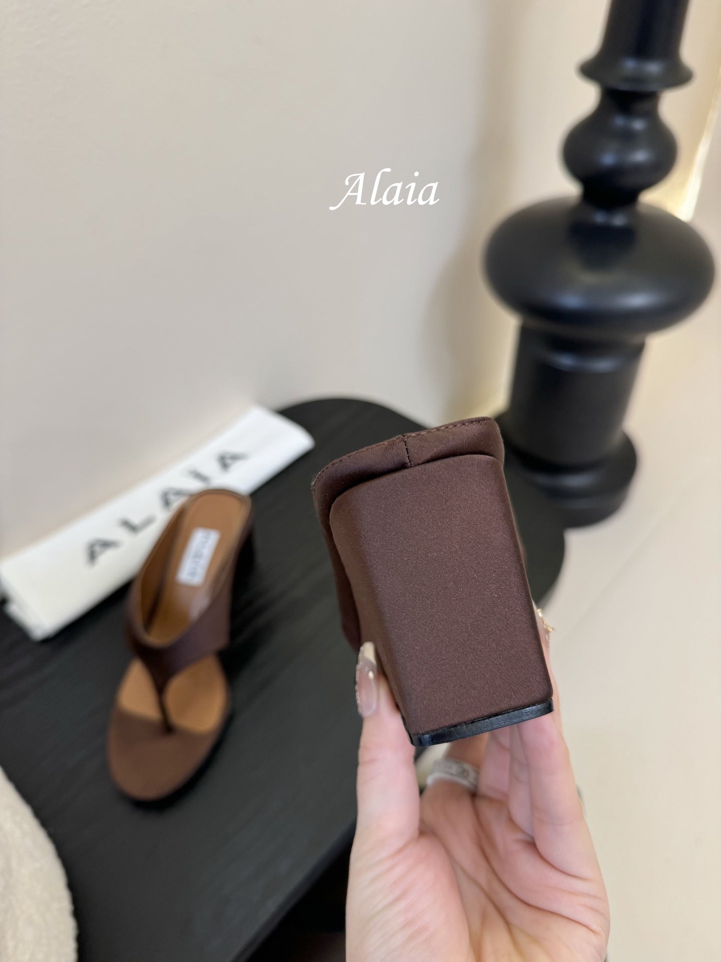 ALAIA WEDGE THONG SANDALS 25S IN BROWN SATIN