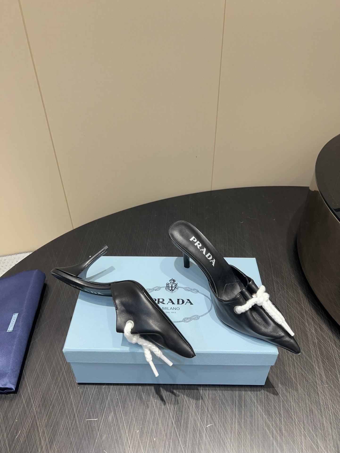 PRADA 25S BRAIDED DETAIL MULES 85MM IN BLACK CALFSKIN