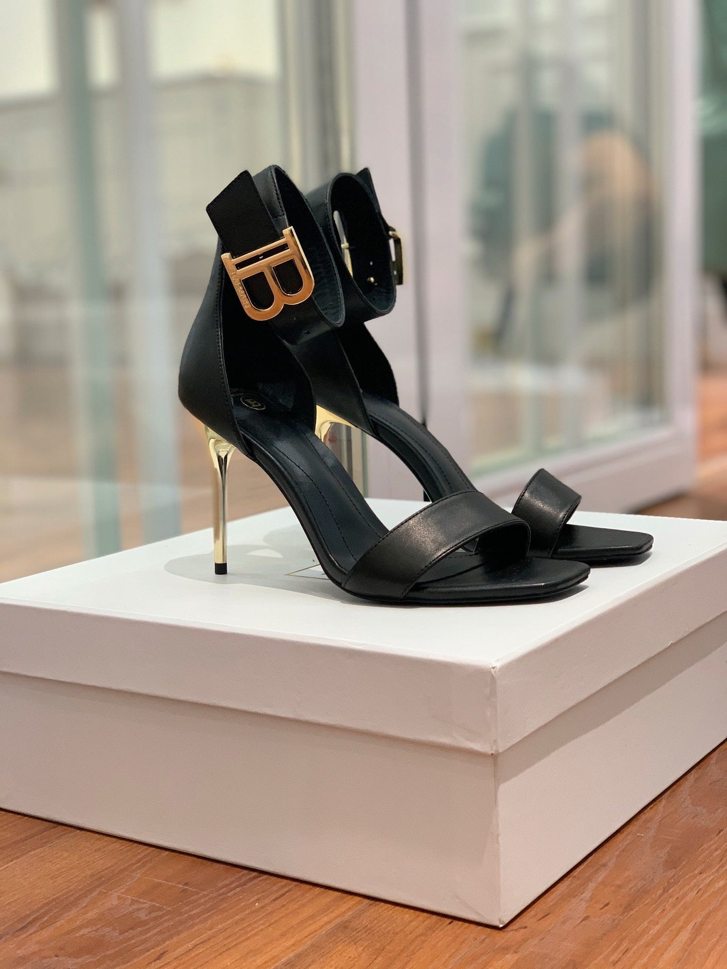 BALMAIN 25S THIN STRAP HIGH HEELS 105MM IN BLACK CALFSKIN GOLD HARDWARE