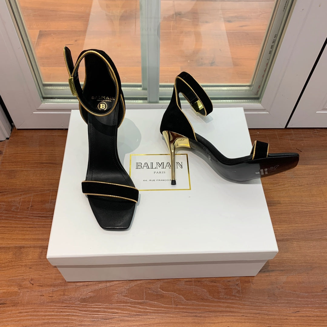 BALMAIN 25S UMA HEELED SANDALS 105MM IN BLACK SUEDE GOLD HARDWARE