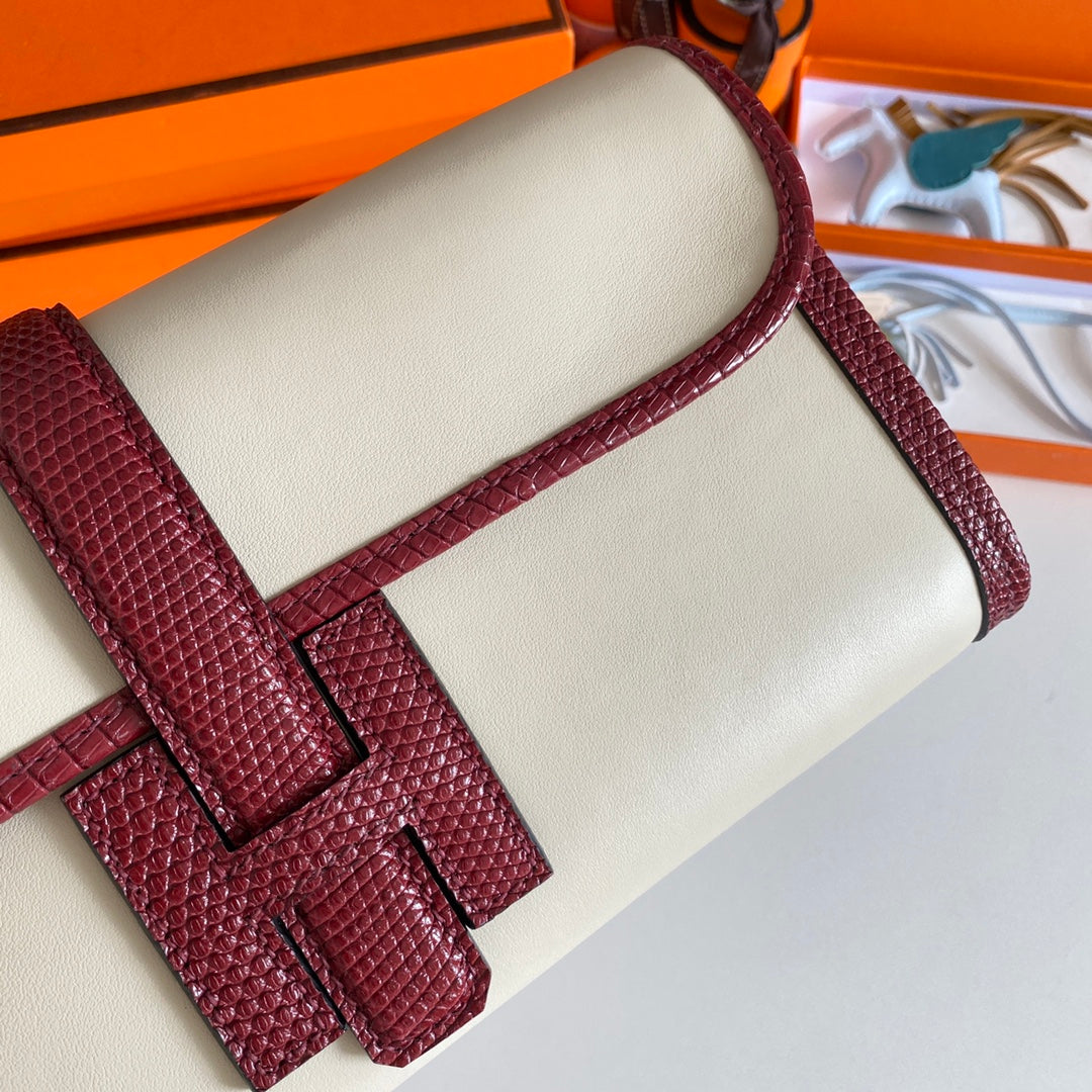 JIGE ELAN 29 CLUTCH IN WHITE CALFSKIN WITH GARNET RED LIZARD SKIN