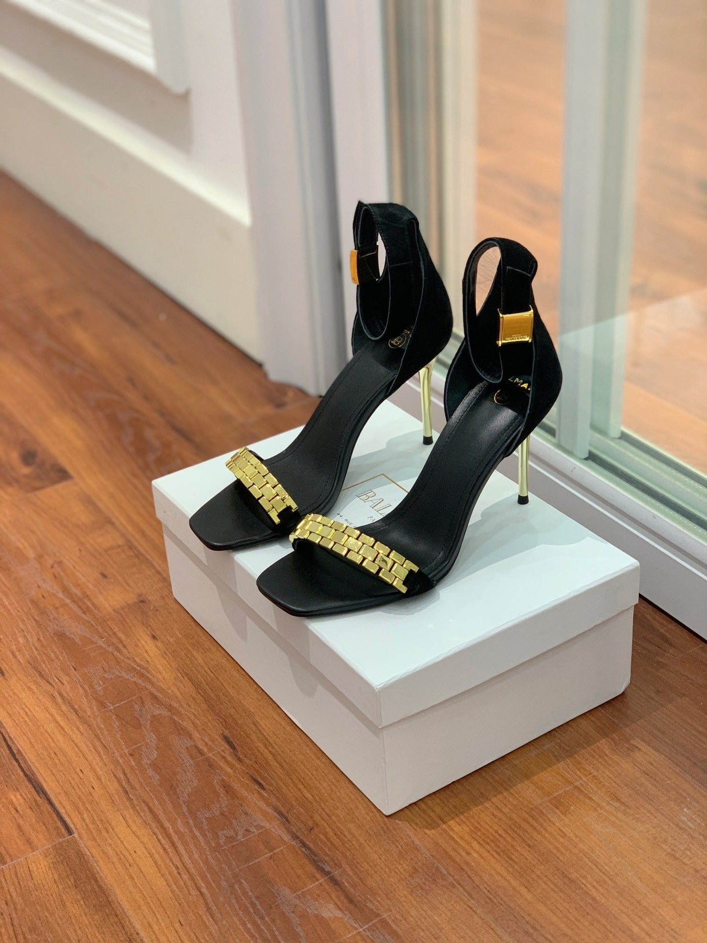 BALMAIN 25S METAL STRAP HIGH HEELS 95MM IN BLACK SUEDE GOLD HARDWARE
