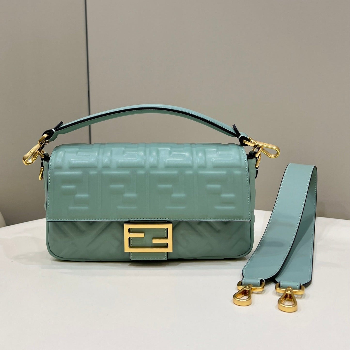 BAGUETTE WITH FF MOTIF 27 IN VIRIDIAN GREEN SOFT LAMBSKIN GOLD HARDWARE