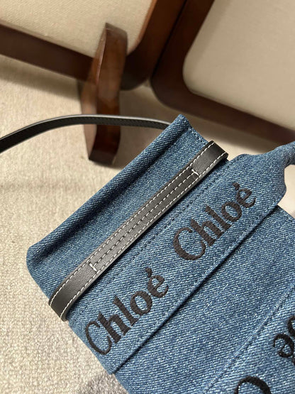 MINI WOODY TOTE BAG 20 IN BLUE DENIM BLACK CALFSKIN