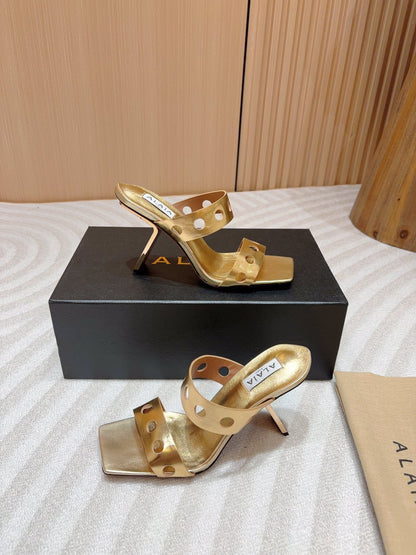 ALAIA TWO-STRAPS HIGH HEEL SANDALS IN GOLDEN PATENT LAMBSKIN