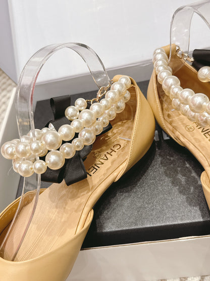 CHANEL 25S ESPADRILLE FLATS IN BEIGE AND BLACK CALFSKIN WITH PEARL STRAP