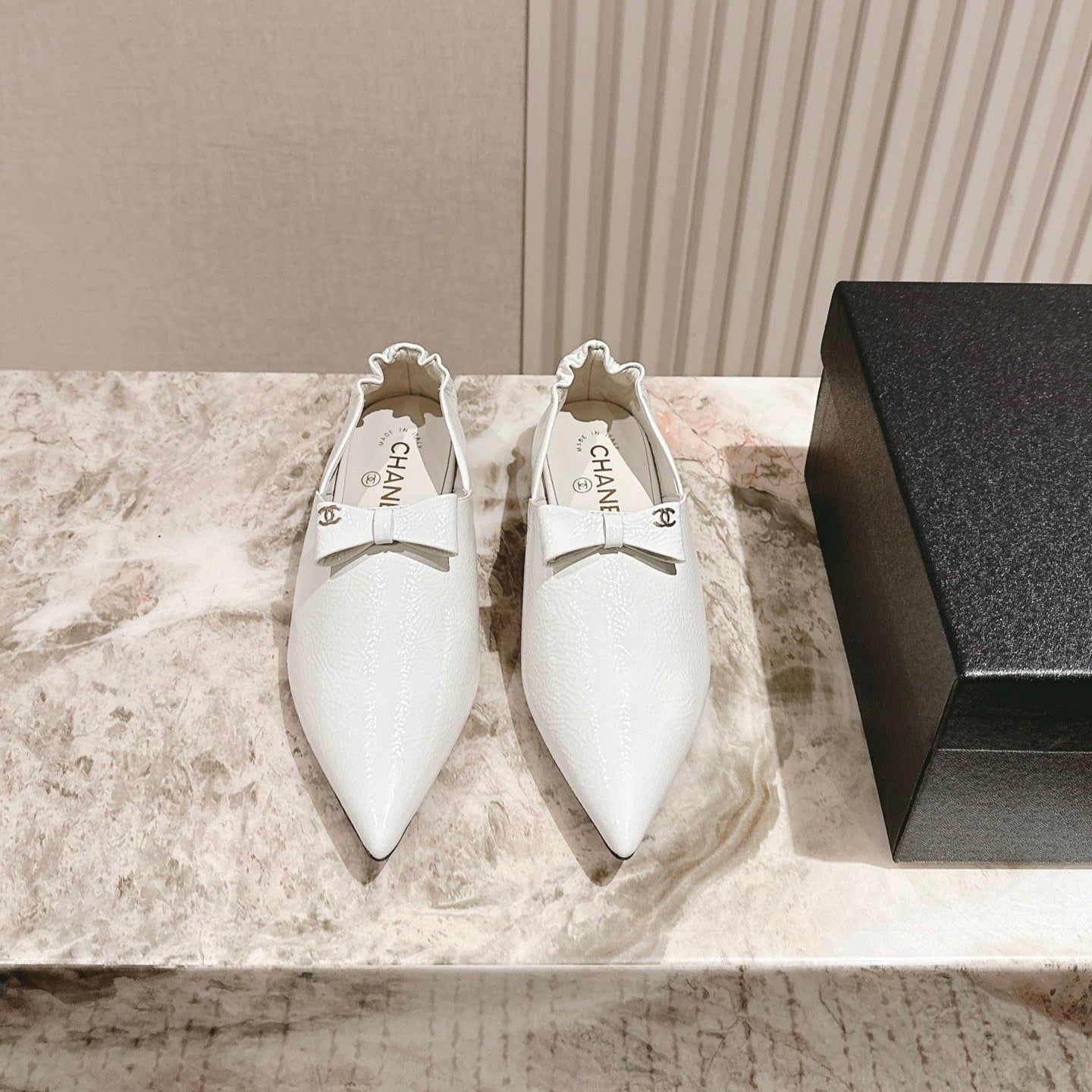 CC FLATS 25S IN WHITE PATENT LEATHER