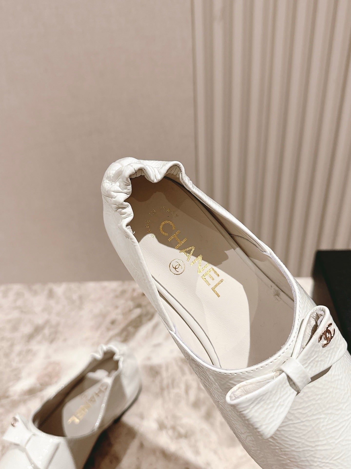 CC FLATS 25S IN WHITE PATENT LEATHER