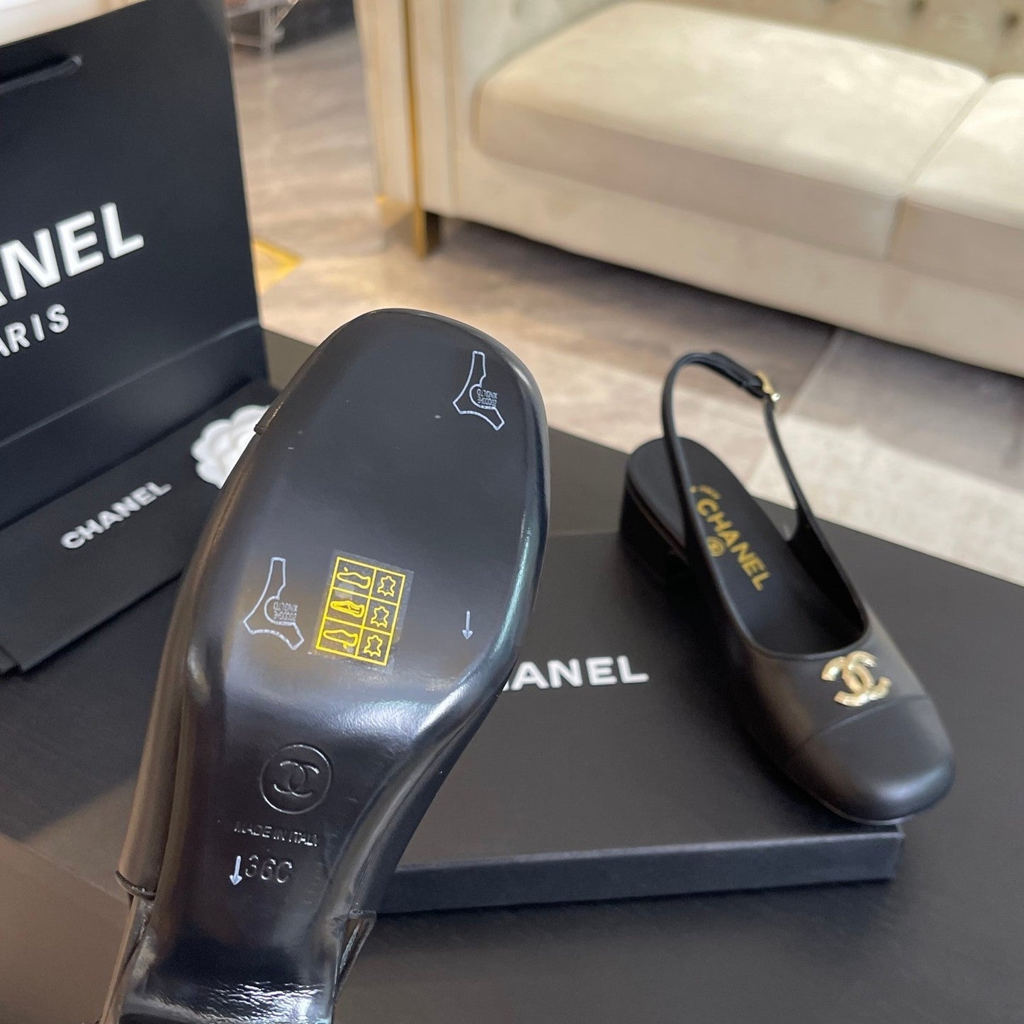 CC SLINGBACKS IN BLACK CALFSKIN