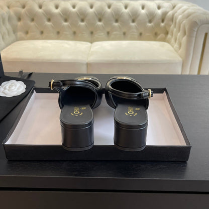 CC SLINGBACKS IN BLACK CALFSKIN