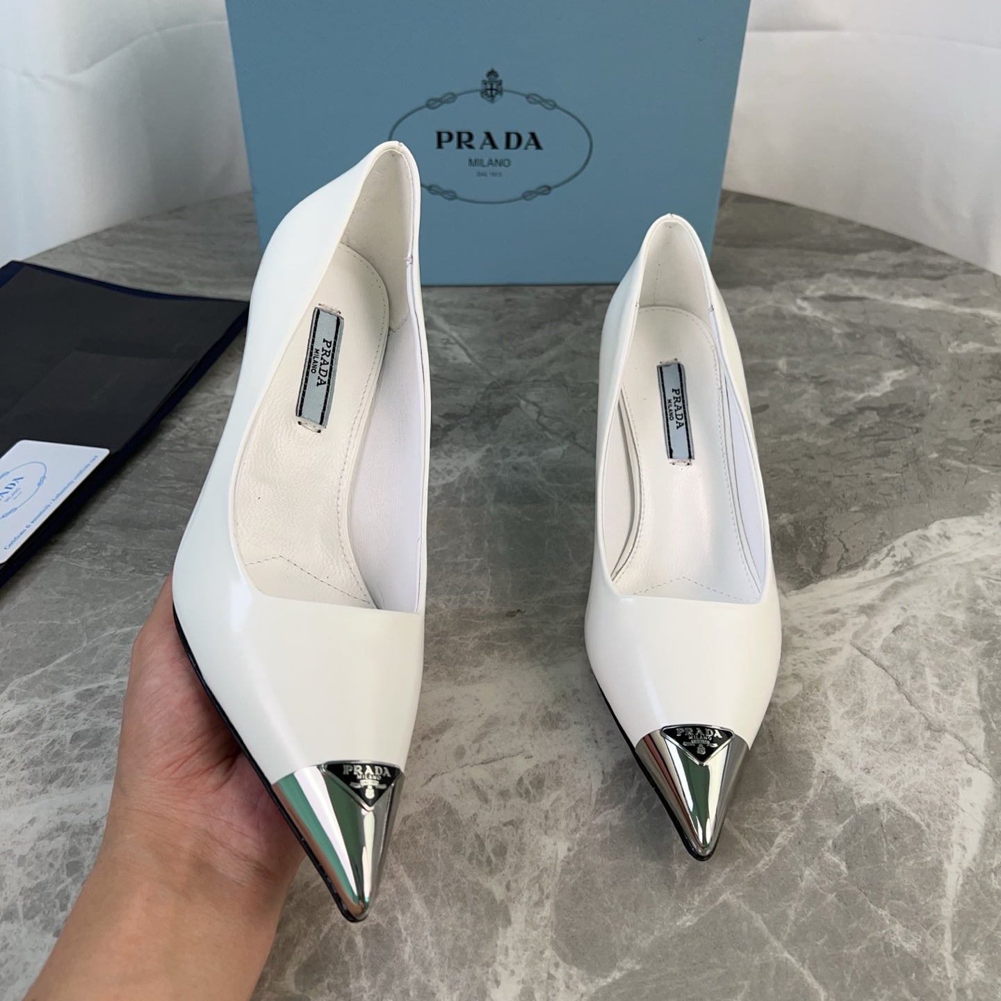 PRADA 25S METAL-CAPPED POINTED-TOE HIGH HEELS IN WHITE CALFSKIN