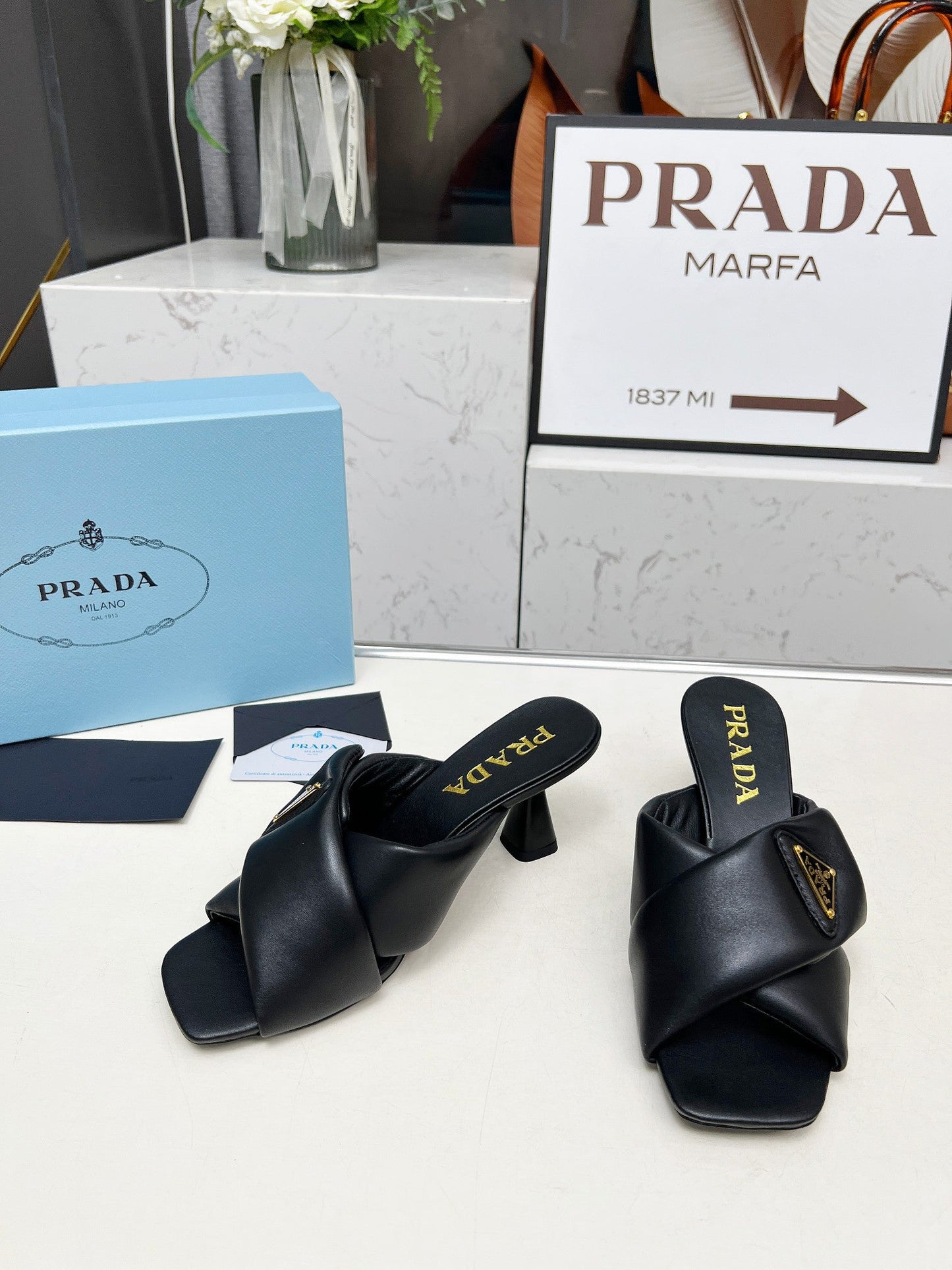 PRA CROSS MULE HEELS IN BLACK CALFSKIN WITH PADDED STRAPS