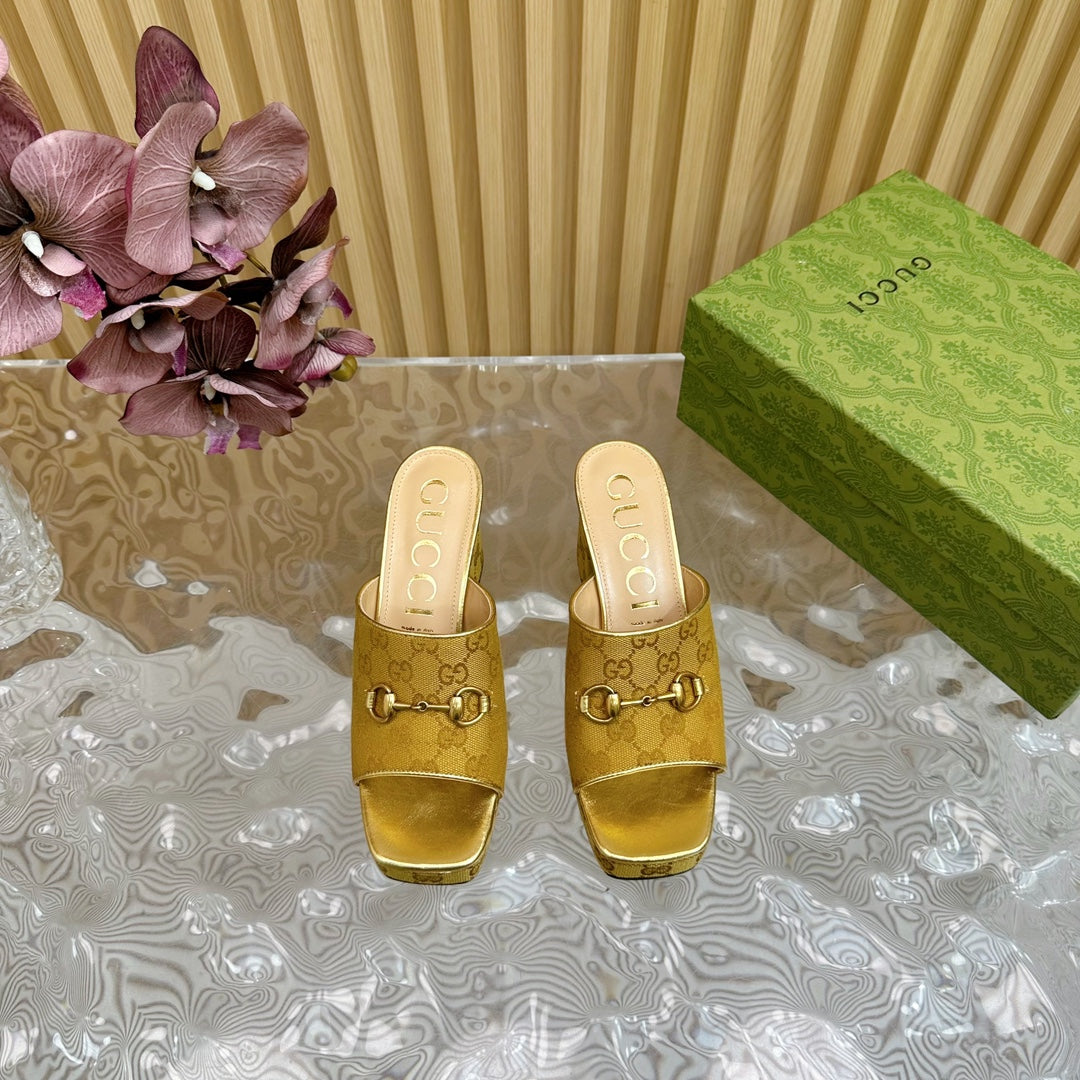 HORSEBIT SLIDE SANDAL IN GOLD MONOGRAM CANVAS AND SHEEPSKIN LINING
