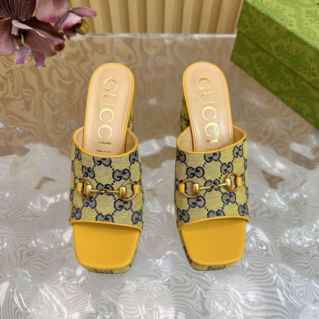 HORSEBIT SLIDE SANDAL IN TUSCANY YELLOW MONOGRAM CANVAS AND SHEEPSKIN LINING