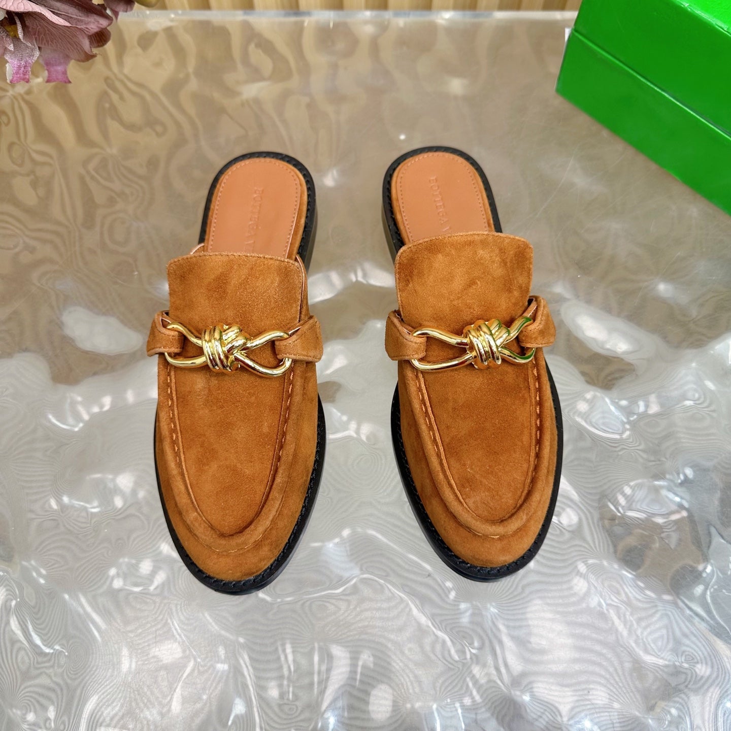 OPEN-BACK LOAFER REALISED IN CINNAMON BROWN SUEDE WITH SIGNATURE METALLIC KNOT DETAIL