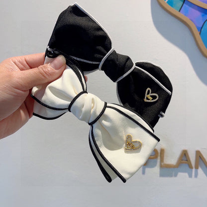 BOW HAIRPIN IN WHITE AND BLACK TRIM COTTON 406023