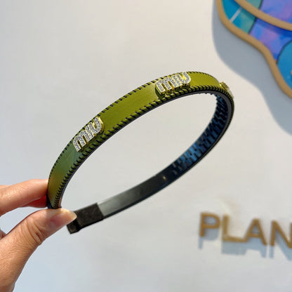 HEAD BAND IN OLIVE GREEN LAMBSKIN AND RESIN 417298