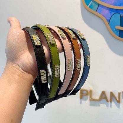 HEAD BAND IN OLIVE GREEN LAMBSKIN AND RESIN 417298