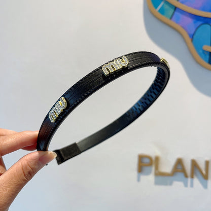 HEAD BAND IN BLACK LAMBSKIN AND RESIN 417299