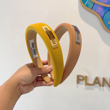 THICK HEADBAND IN BRONZE ORANGE DIAGONAL LEATHER 425479