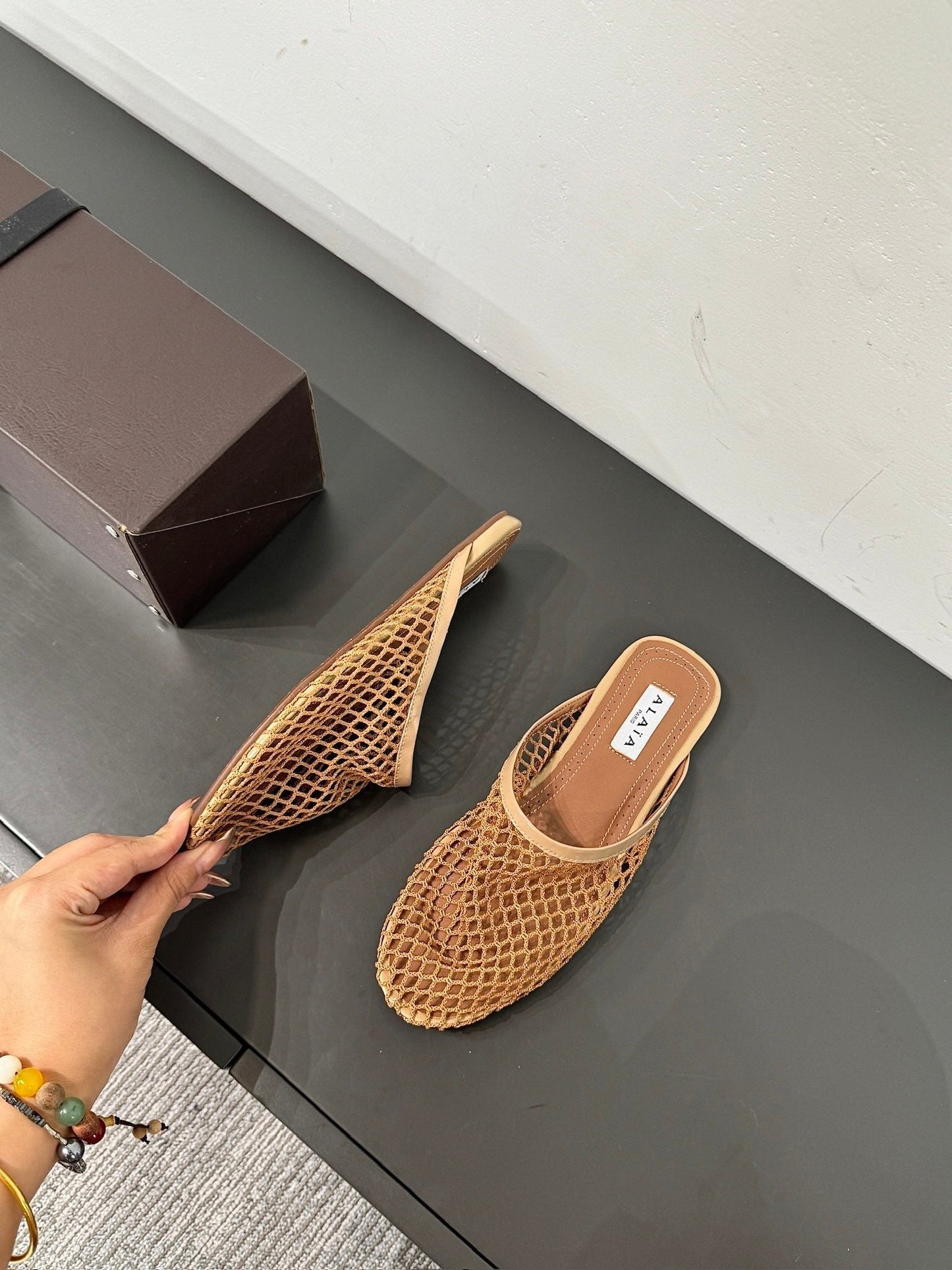 ALAIA FLAT MULES IN COPPER BROWN MESH FISHNET