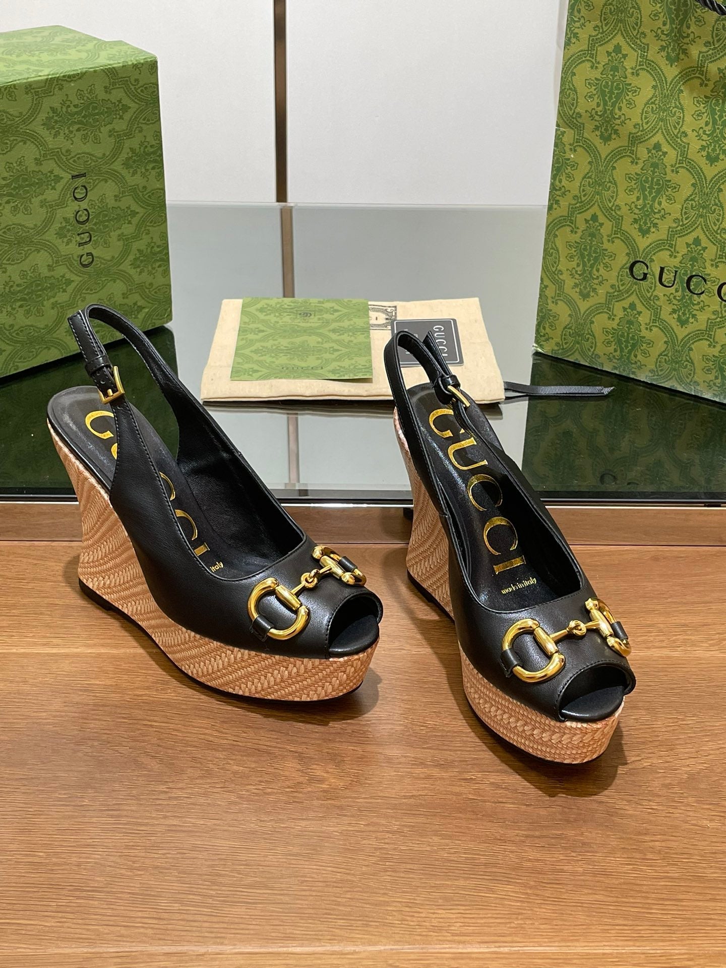 GG WEDGE PLATFORM IN BLACK CALFSKIN WITH GOLD HARDWARE