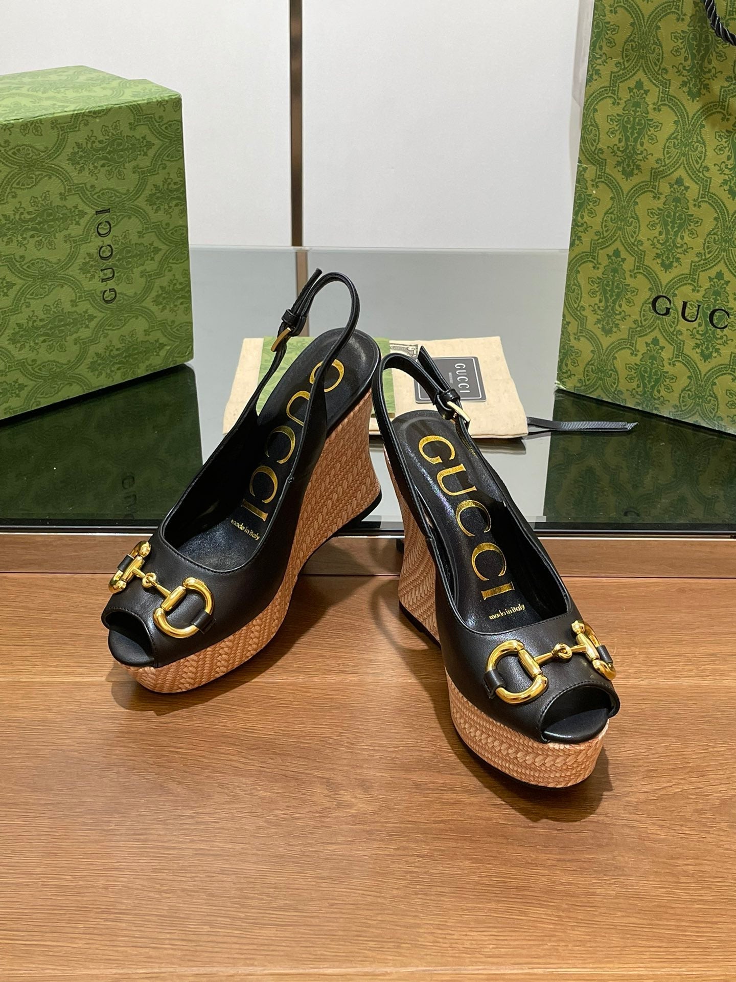 GG WEDGE PLATFORM IN BLACK CALFSKIN WITH GOLD HARDWARE