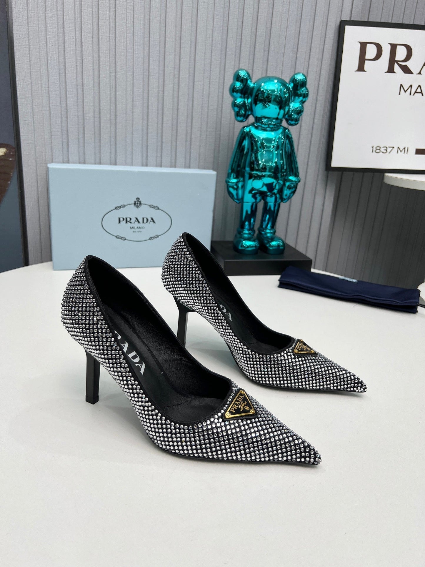 TRIANGLE LOGO HIGH-HEEL PUMPS IN BLACK SATIN WITH WHITE CRYSTALS