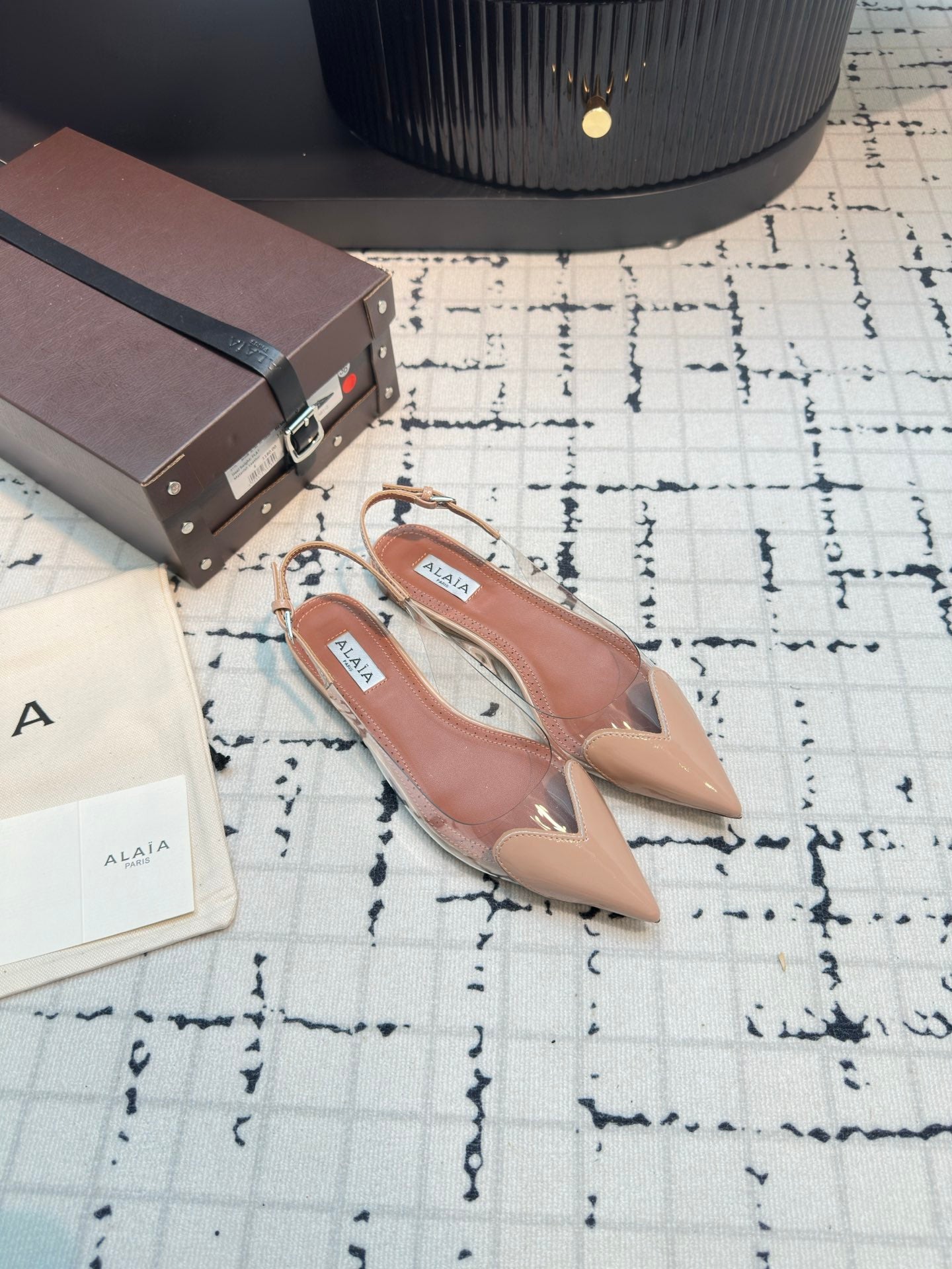 ALAIA FLAT SLINGBACK IN BEIGE BISQUE PATENT CALFSKIN AND FILM
