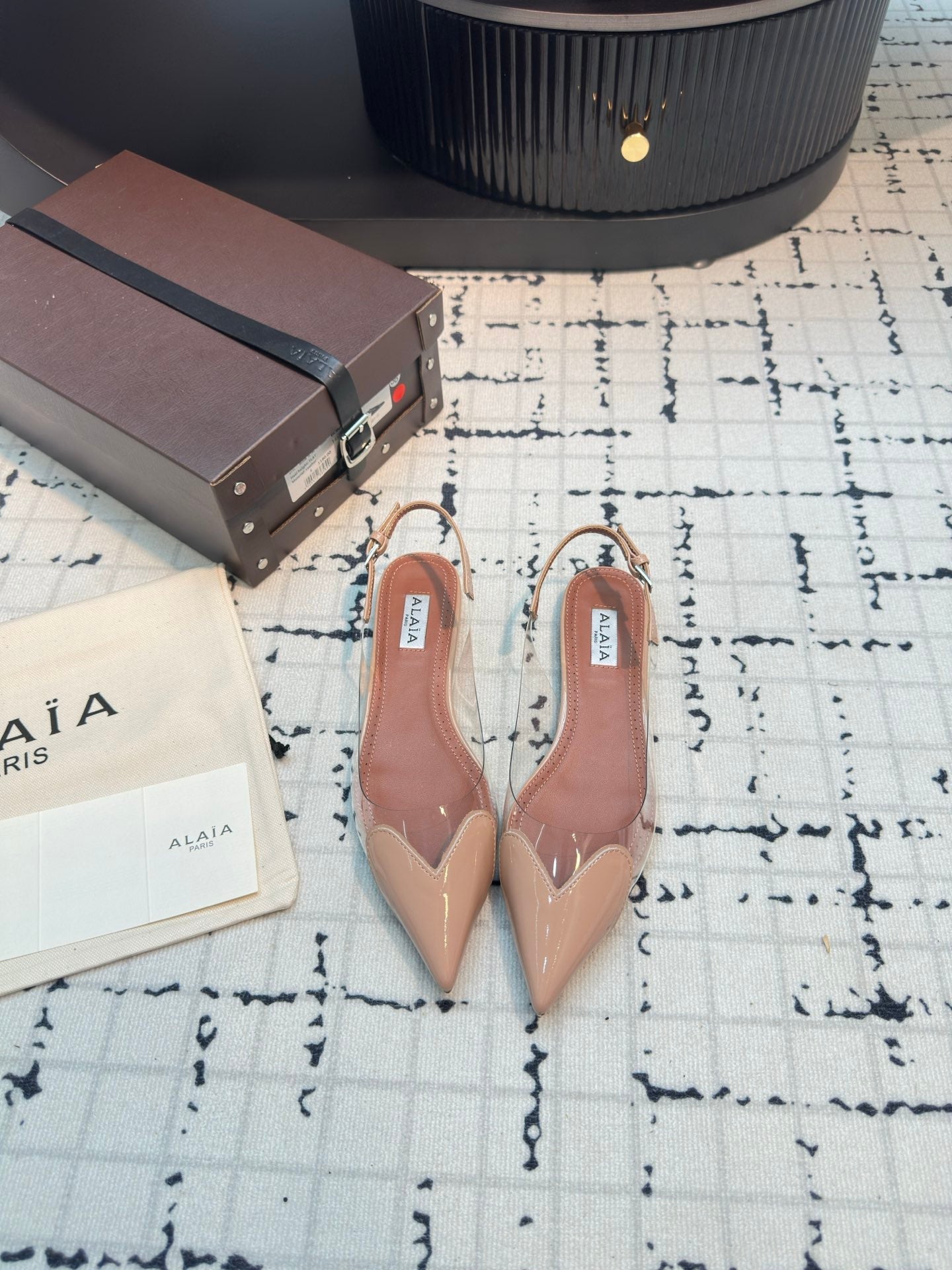 ALAIA FLAT SLINGBACK IN BEIGE BISQUE PATENT CALFSKIN AND FILM