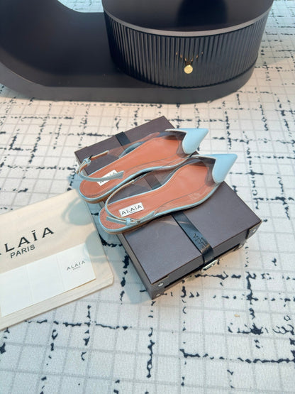 ALAIA FLAT SLINGBACK IN LIGHT BLUE PATENT CALFSKIN AND FILM