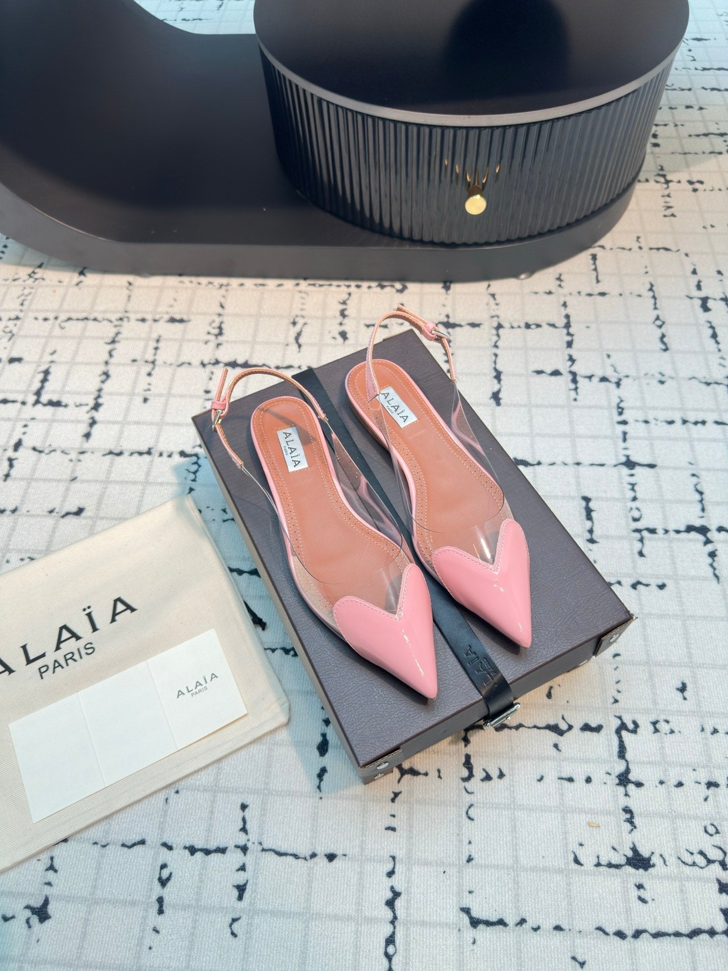 ALAIA FLAT SLINGBACK IN ROSE PINK PATENT CALFSKIN AND FILM