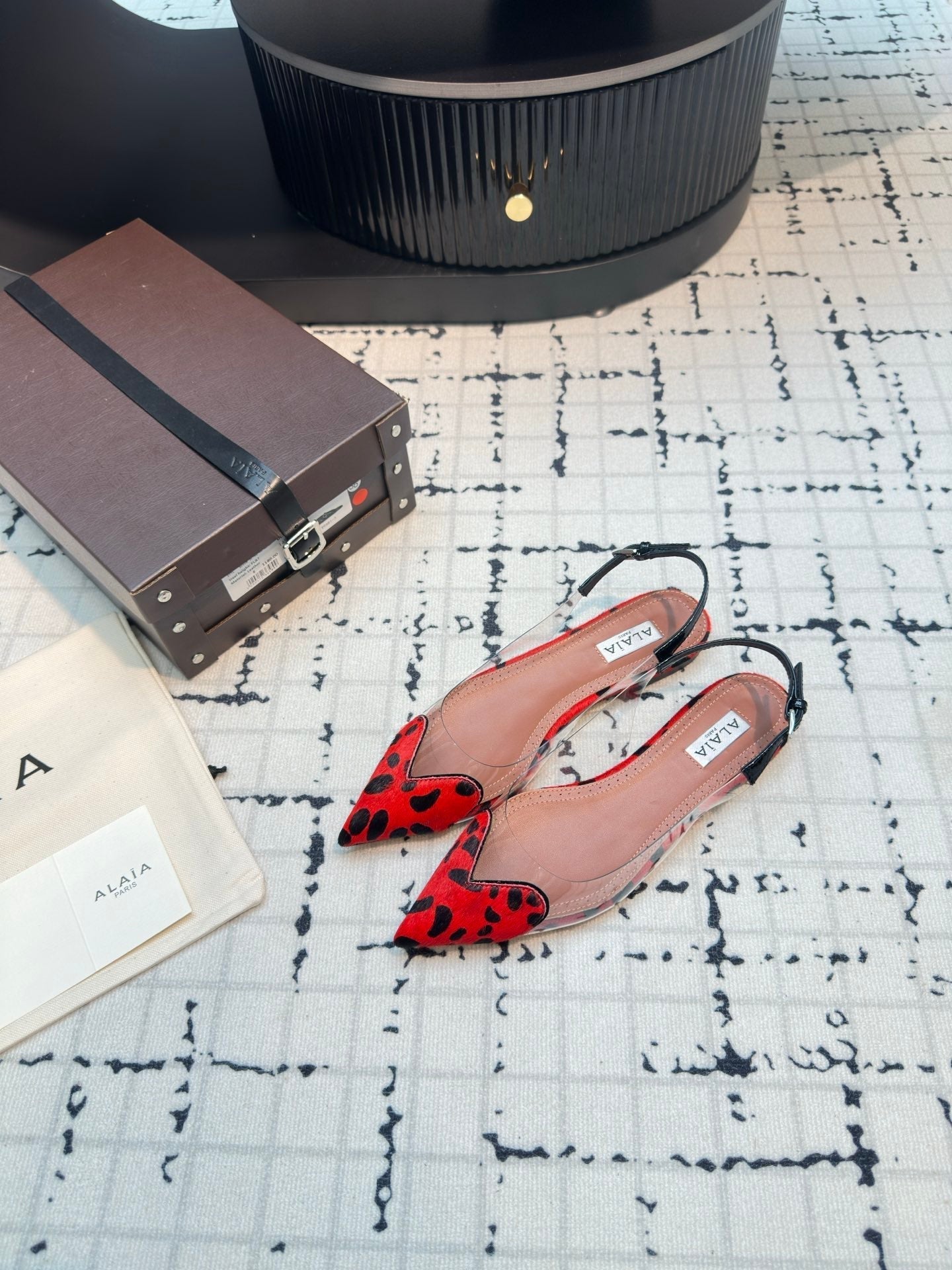 ALAIA FLAT SLINGBACK IN CHERRY RED PATENT CALFSKIN AND FILM