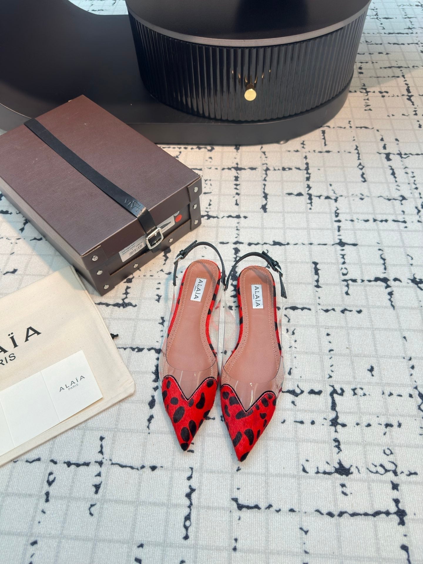 ALAIA FLAT SLINGBACK IN CHERRY RED PATENT CALFSKIN AND FILM