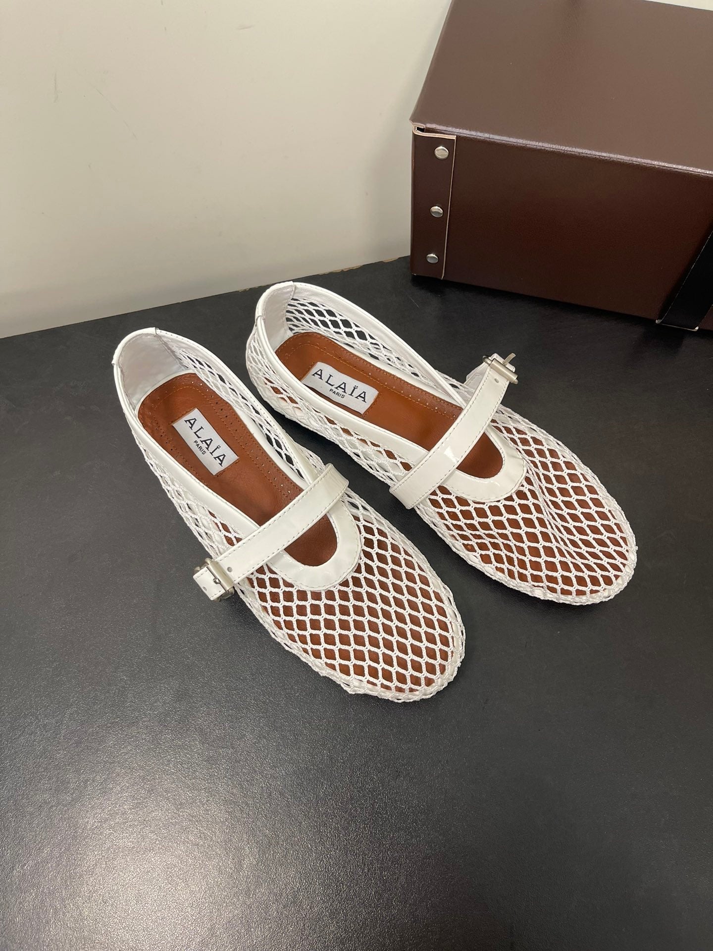 ALAIA BALLET FLATS IN WHITE MESH FISHNET