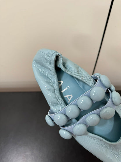 ALAIA SPHERE BALLET FLATS IN LIGHT BLUE LAMBSKIN