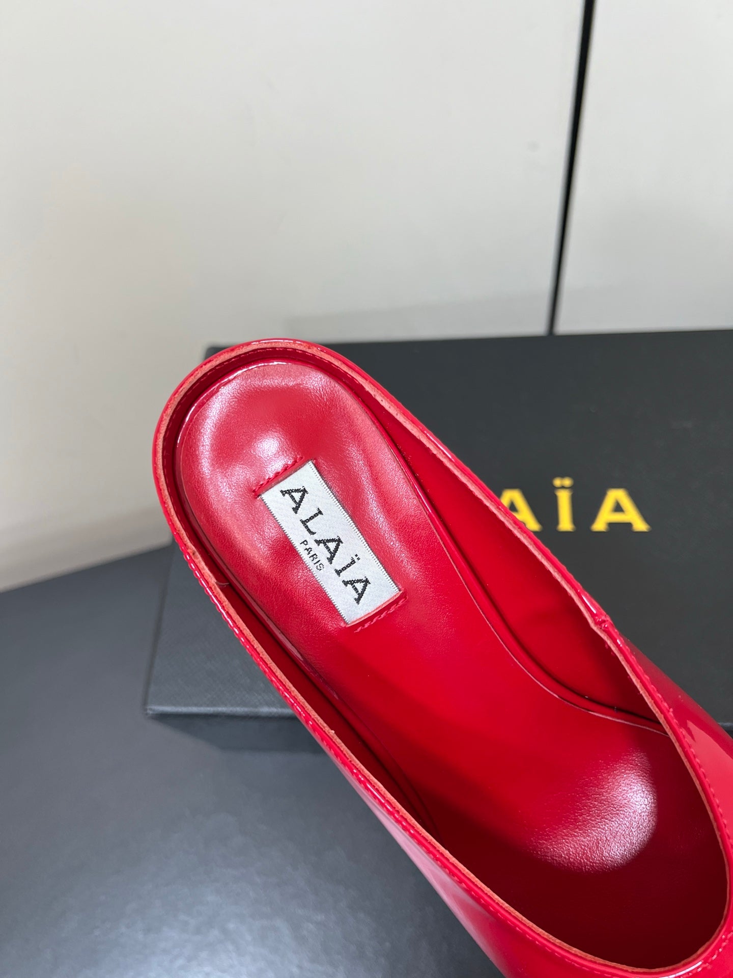 ALAIA WEDGE MULES 25S IN RED LAMBSKIN