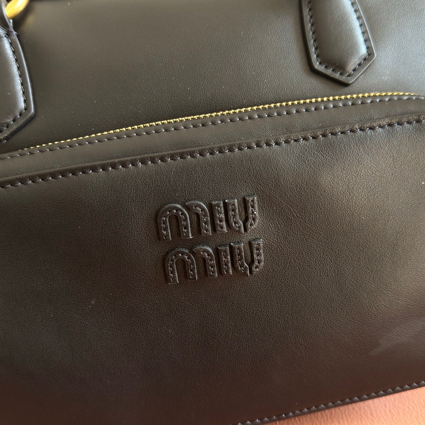 MIUMIU 26S POCKET TOP-HANDLE BAG 32 IN BLACK CALFSKIN GOLD HARDWARE