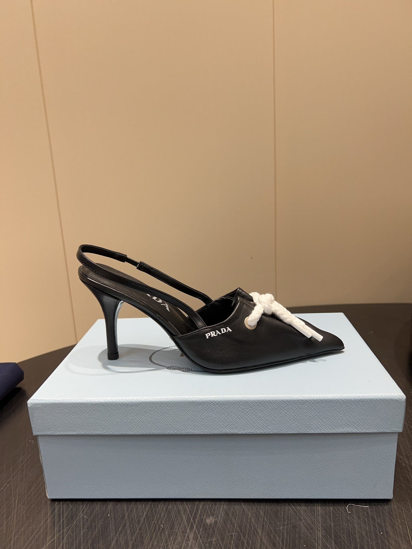 PRADA 25S POINTED TOE SLINGBACK 85MM IN BLACK LAMBSKIN WITH TIE UP DESIGN