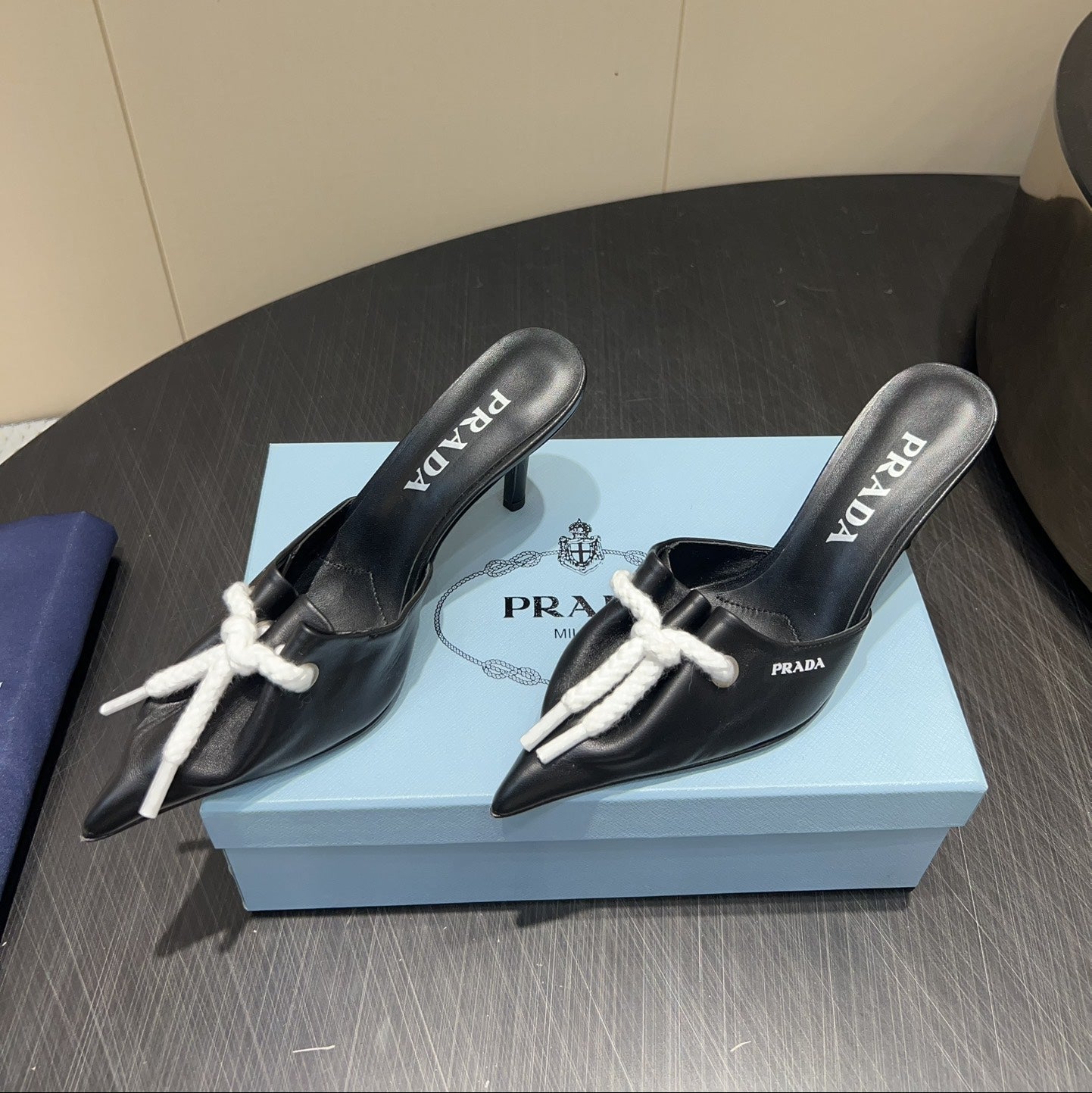 PRADA 25S BRAIDED DETAIL MULES 85MM IN BLACK CALFSKIN