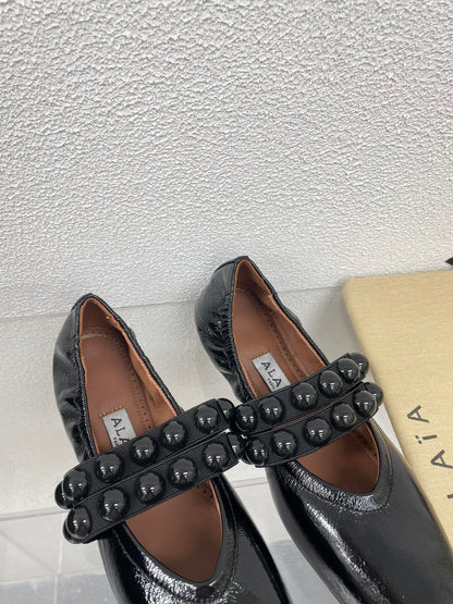 ALAIA MARY JANE PEARL IN GLOSSY BLACK LAMBSKIN