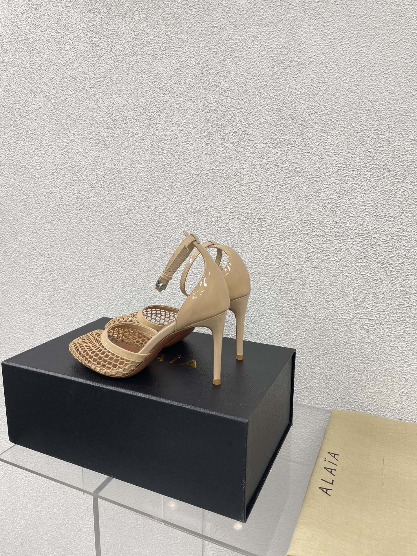 ALAIA HIGH FISHNET 9 CM PUMPS IN EGG NOG MESH