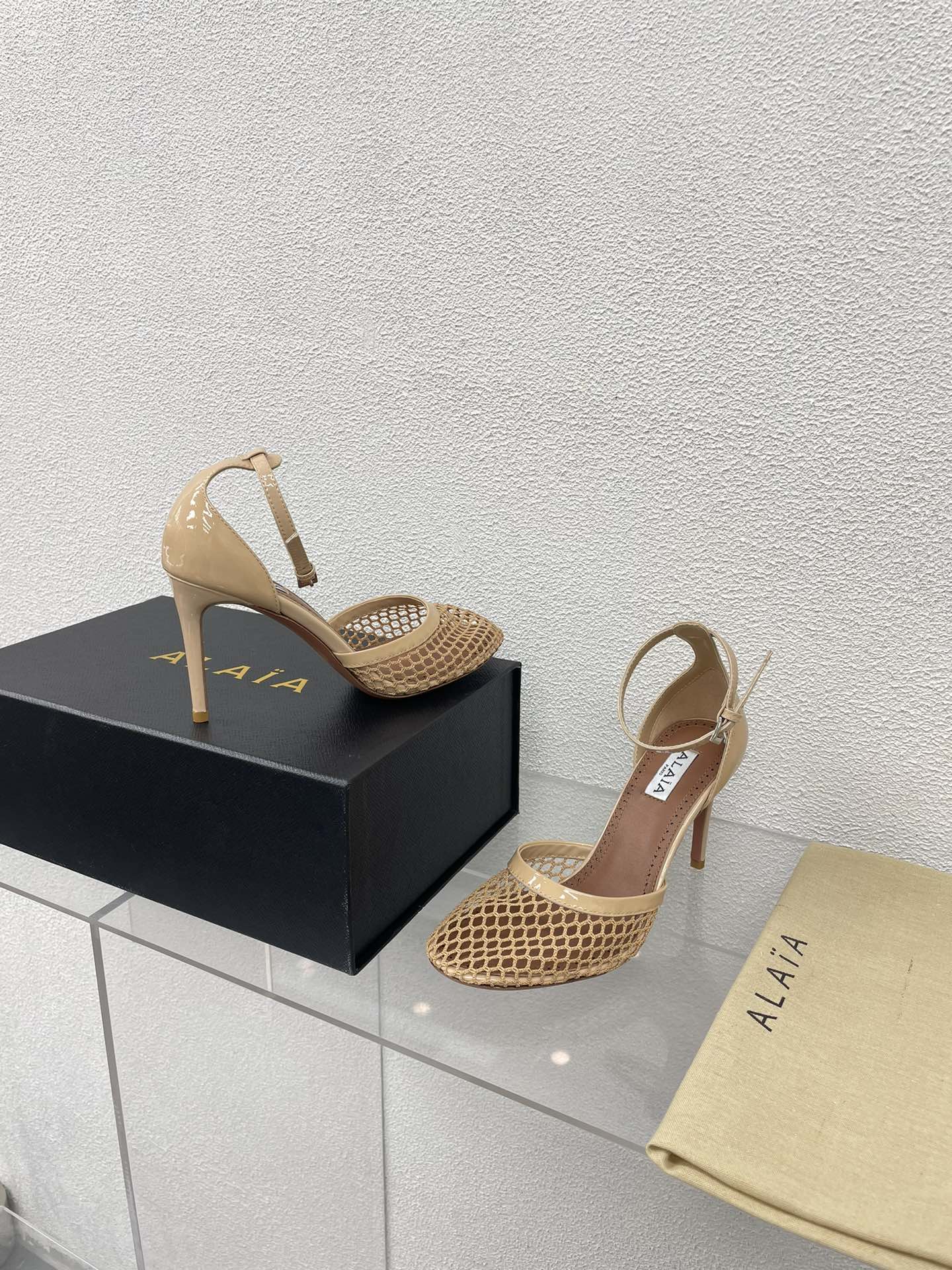 ALAIA HIGH FISHNET 9 CM PUMPS IN EGG NOG MESH
