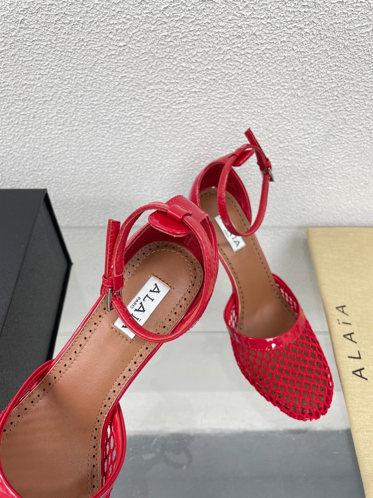 ALAIA HIGH FISHNET 9 CM PUMPS IN CHERRY RED MESH