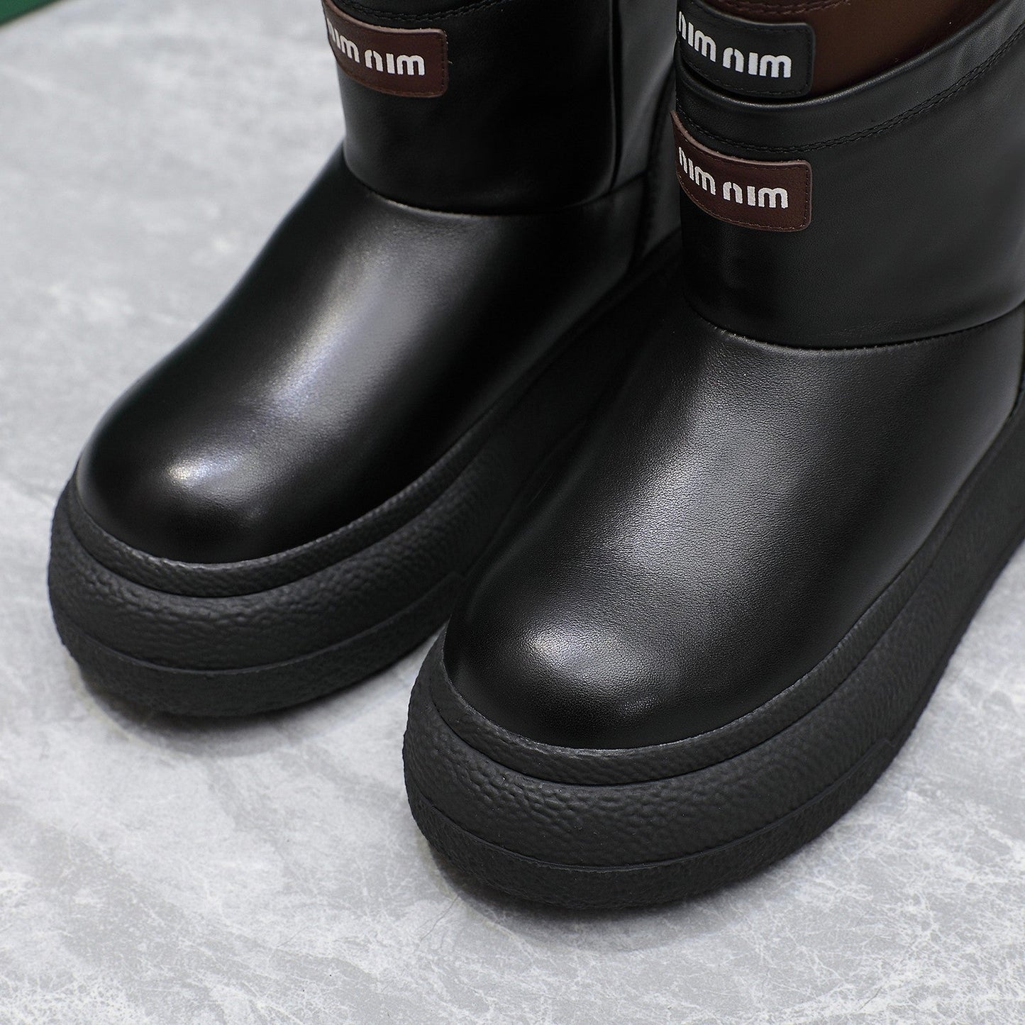 THICK-SOLED SNOW BOOTS IN BLACK CALFSKIN MIX CHOCOLATE NYLON