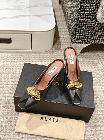 ALAIA SPIKE JEWEL MULES IN BLACK CALFSKIN WITH GOLD HARDWARE