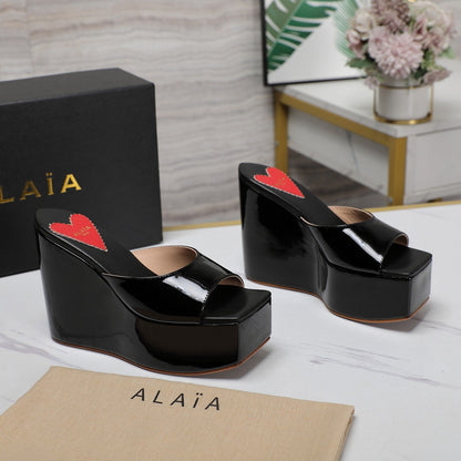 ALAIA PLATFORM WEDGE IN BLACK LAMBSKIN WITH RED HEART