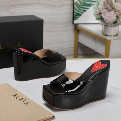 ALAIA PLATFORM WEDGE IN BLACK LAMBSKIN WITH RED HEART